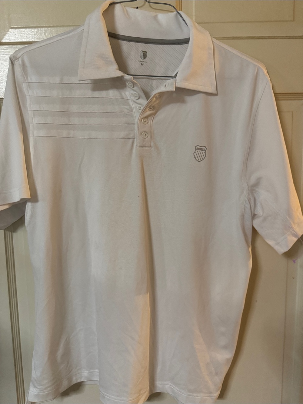 K-Swiss White Polo with Subtle Chest Stripes and Shield Logo